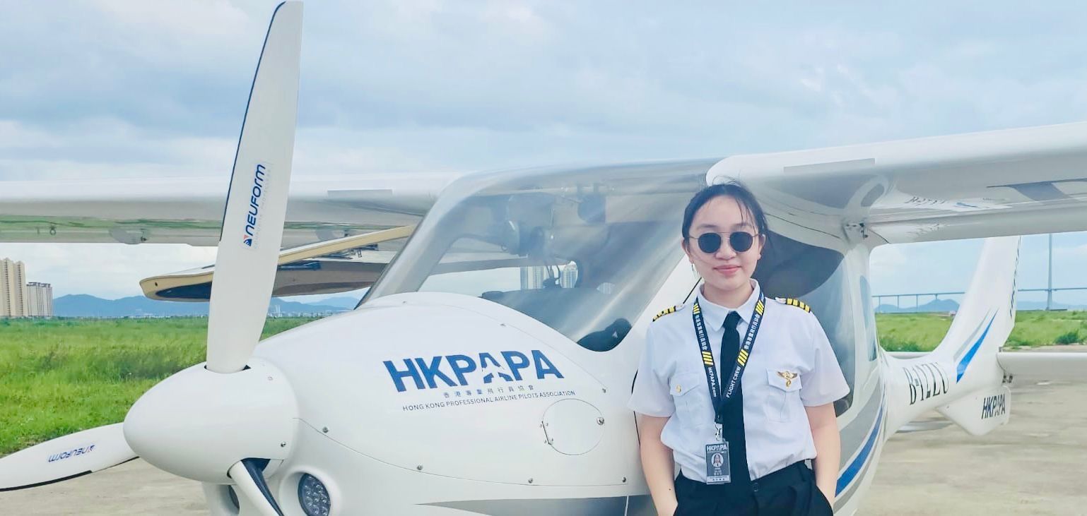 HKPAPA cadet beside the CTLS training aircraft